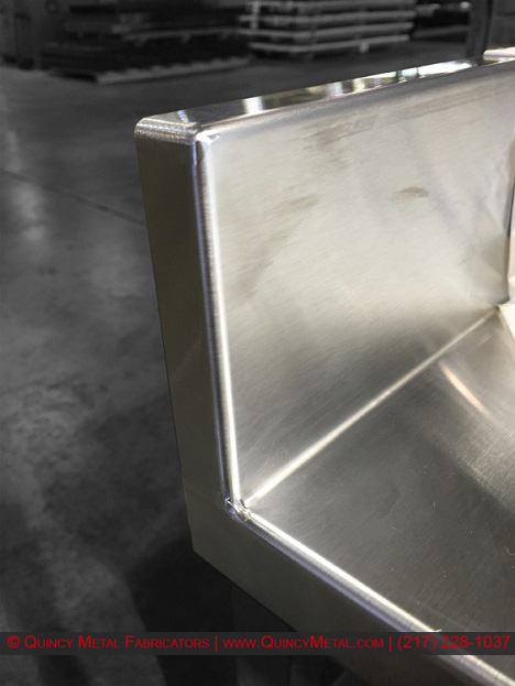 Superior stainless steel welding shown on a countertop piece, from Quincy Metal Fabricators' welding department