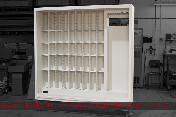 A complex precision sheet metal cabinet assembly ready for shipment